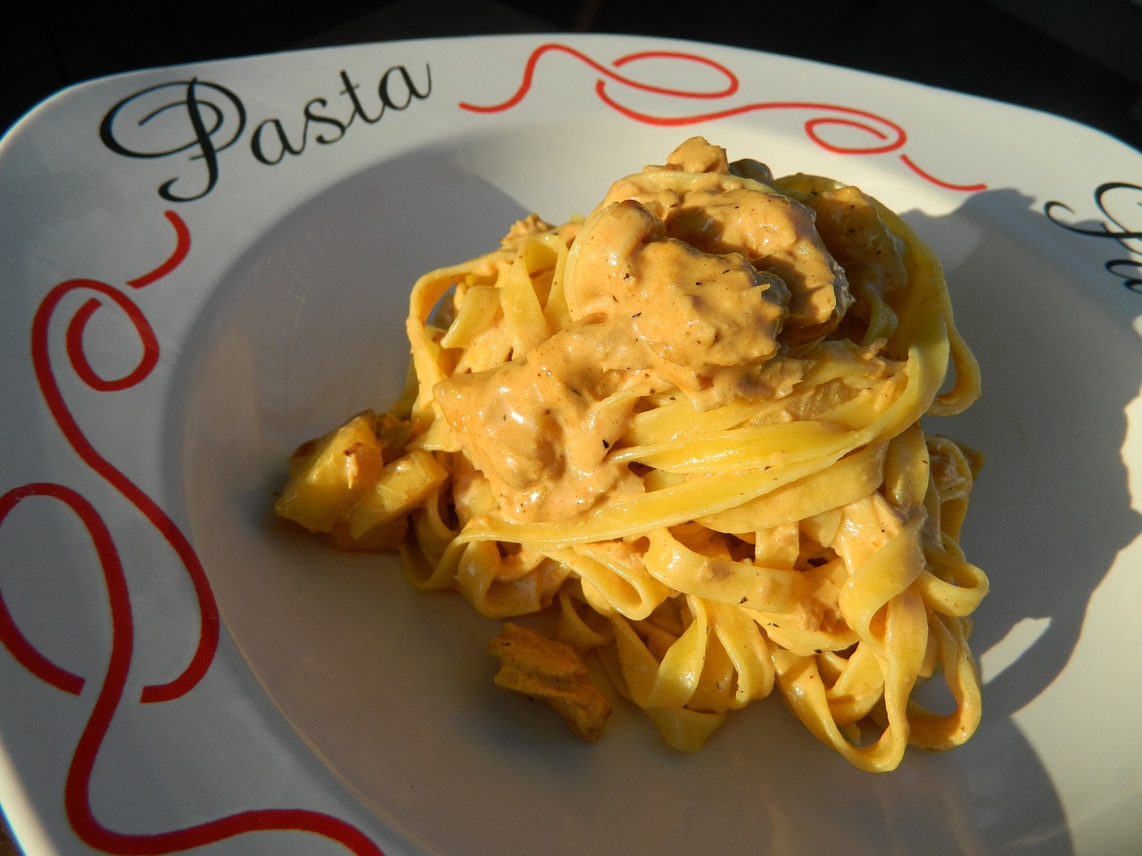 Tuna pasta in a bowl that says pasta on the side